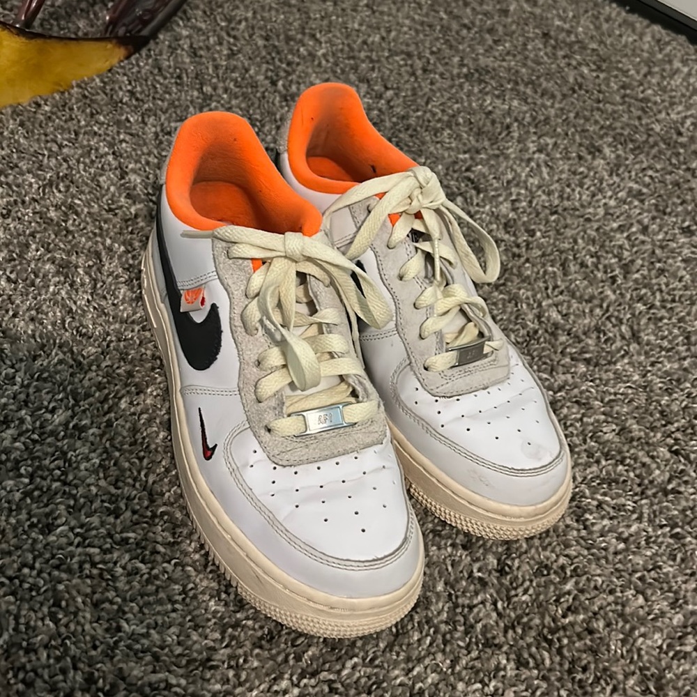 White, orange and black Nikes